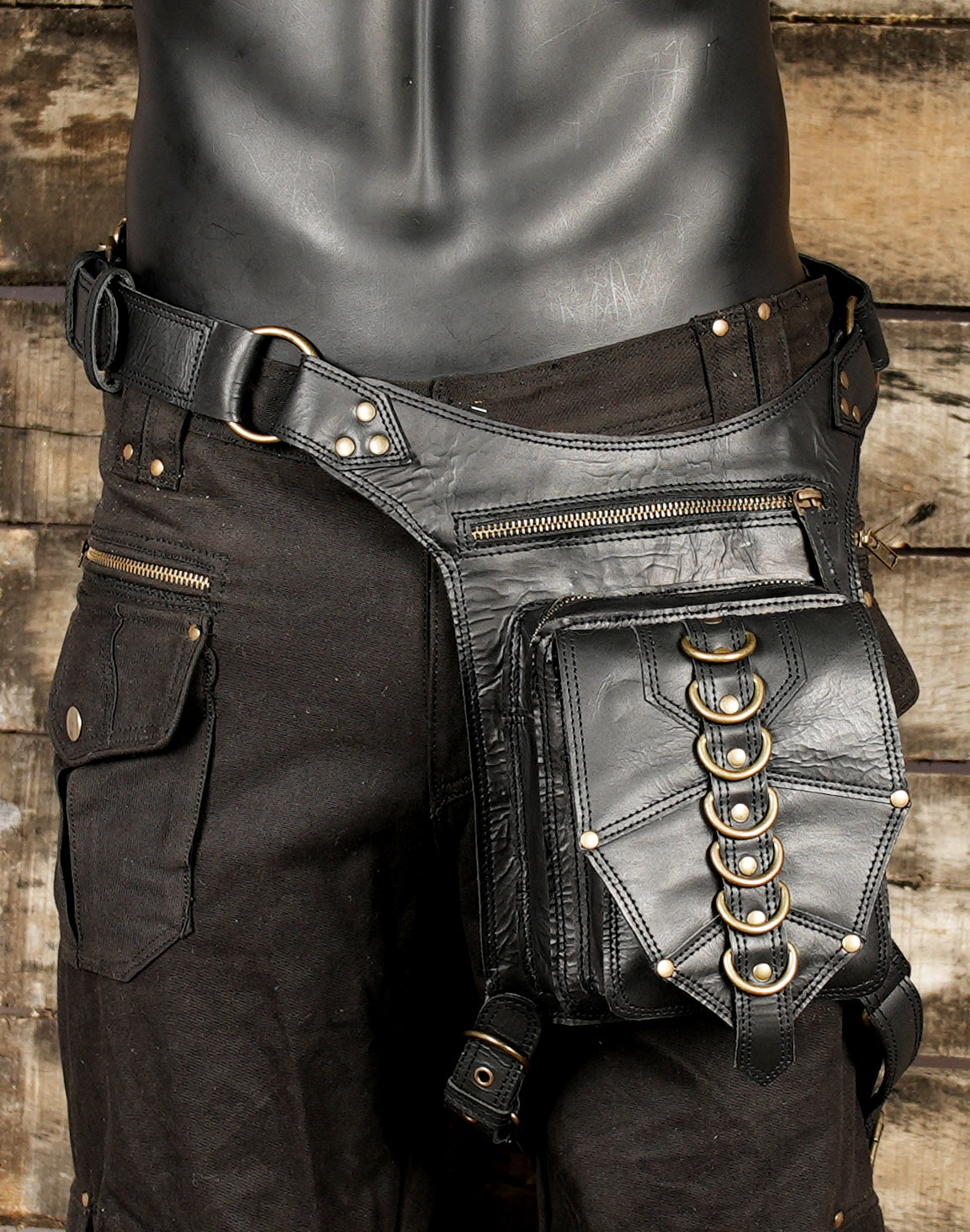 The standout feature of this belt is the decorative ring accents and strong stitched panel design