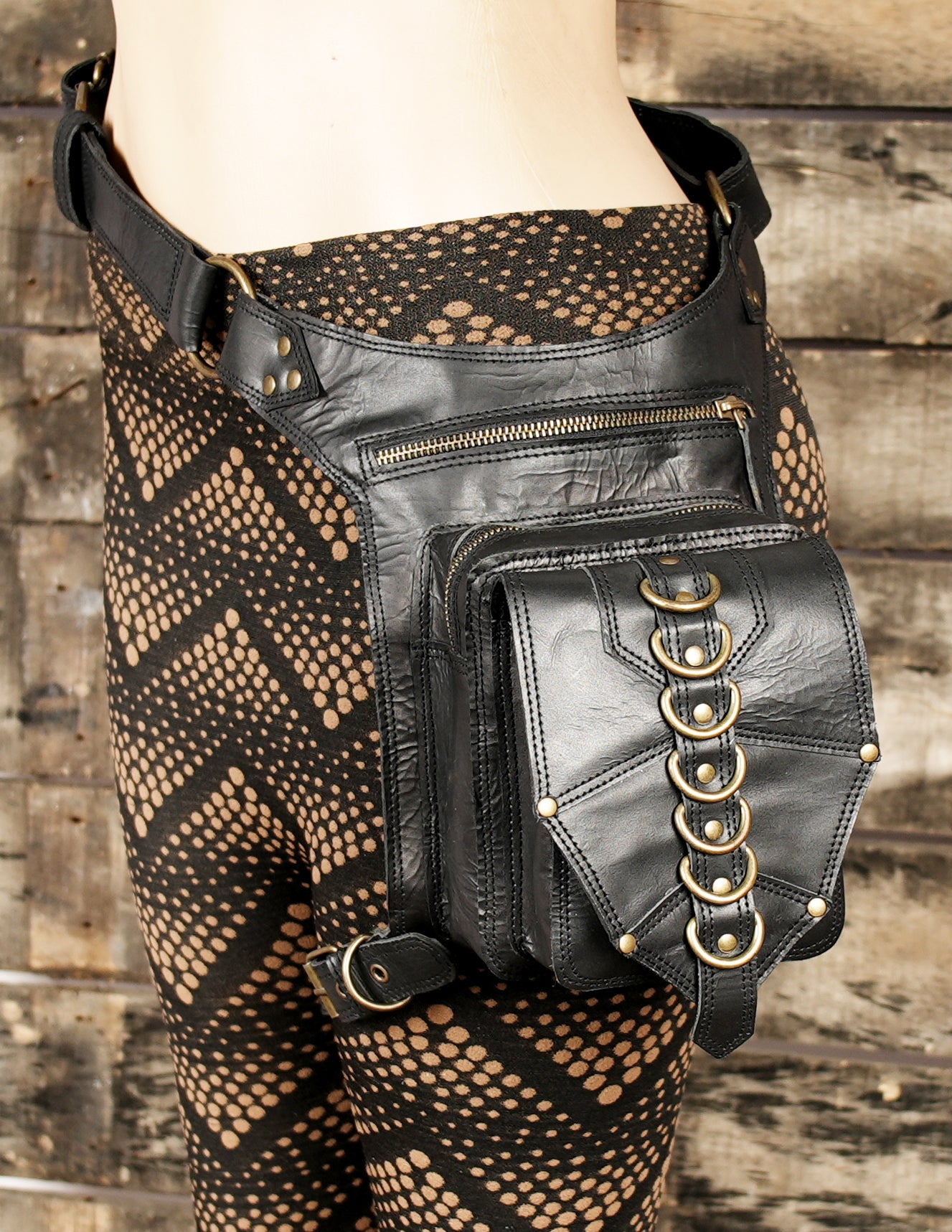 The spacious pouch with zipper closure provides ample space to carry your phone, wallet, cards, and other essentials.