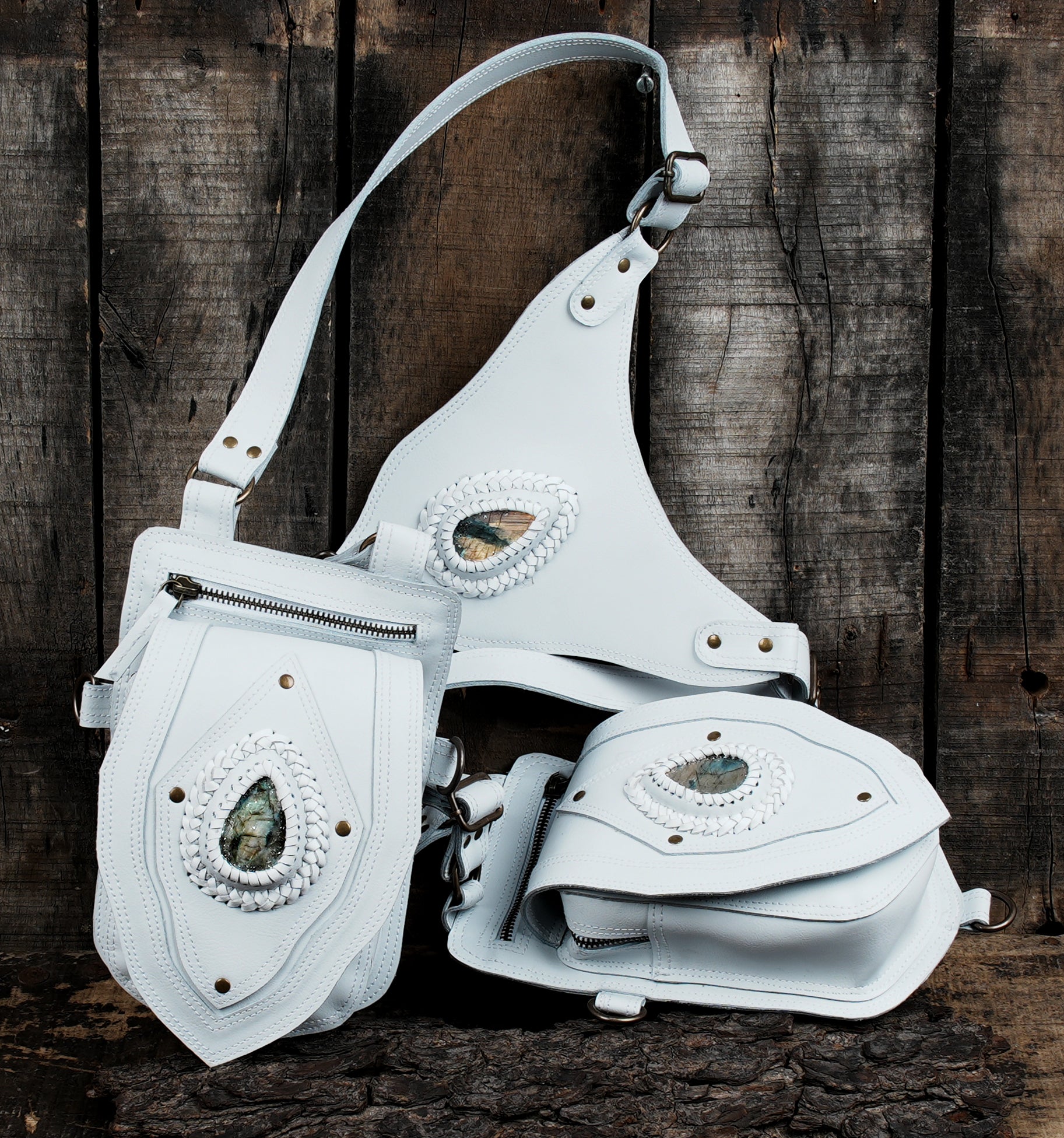 White leather holster bag with gemstone centerpiece and straps