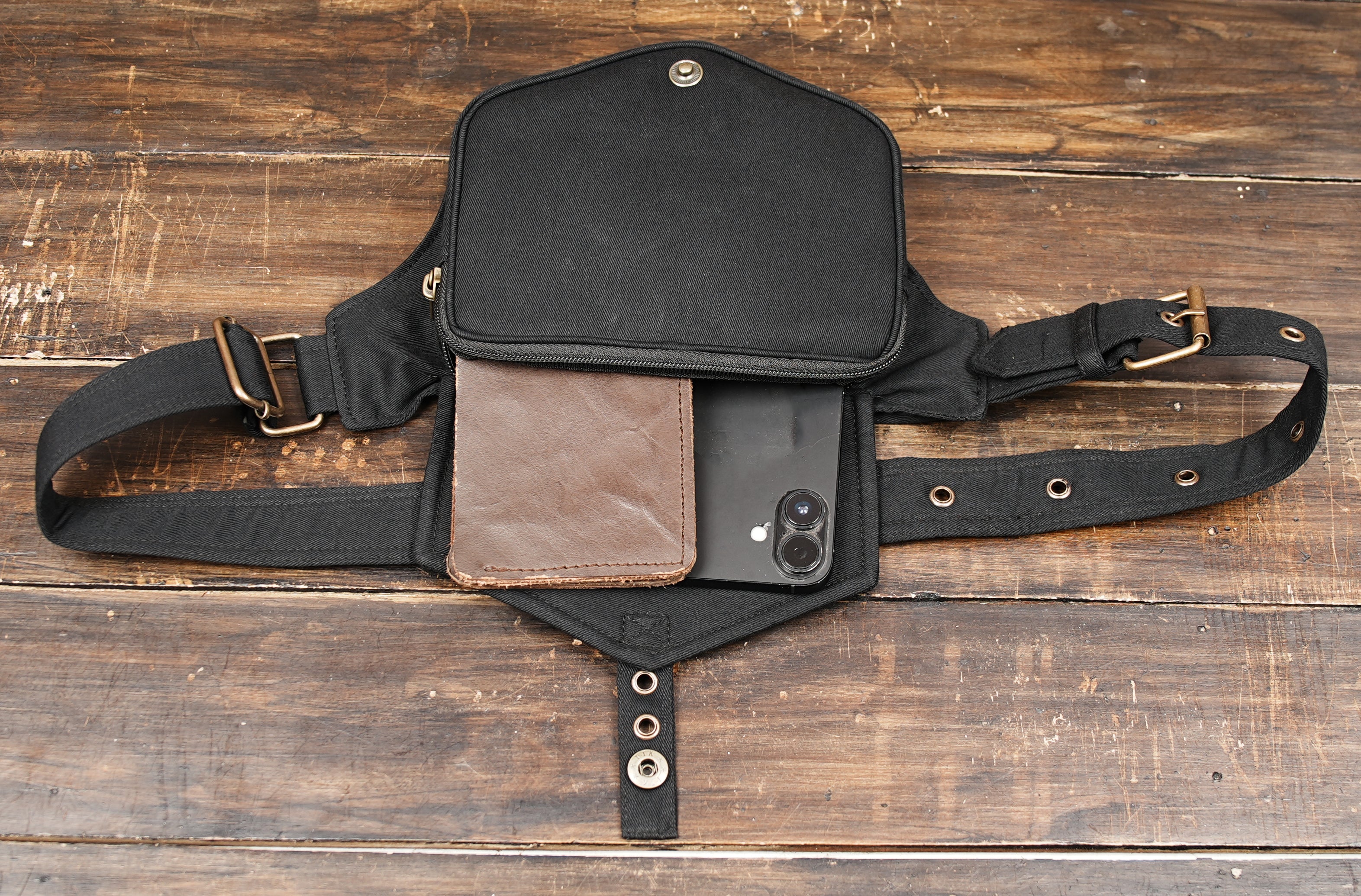 Stylish black belt bag with gold snap button closure