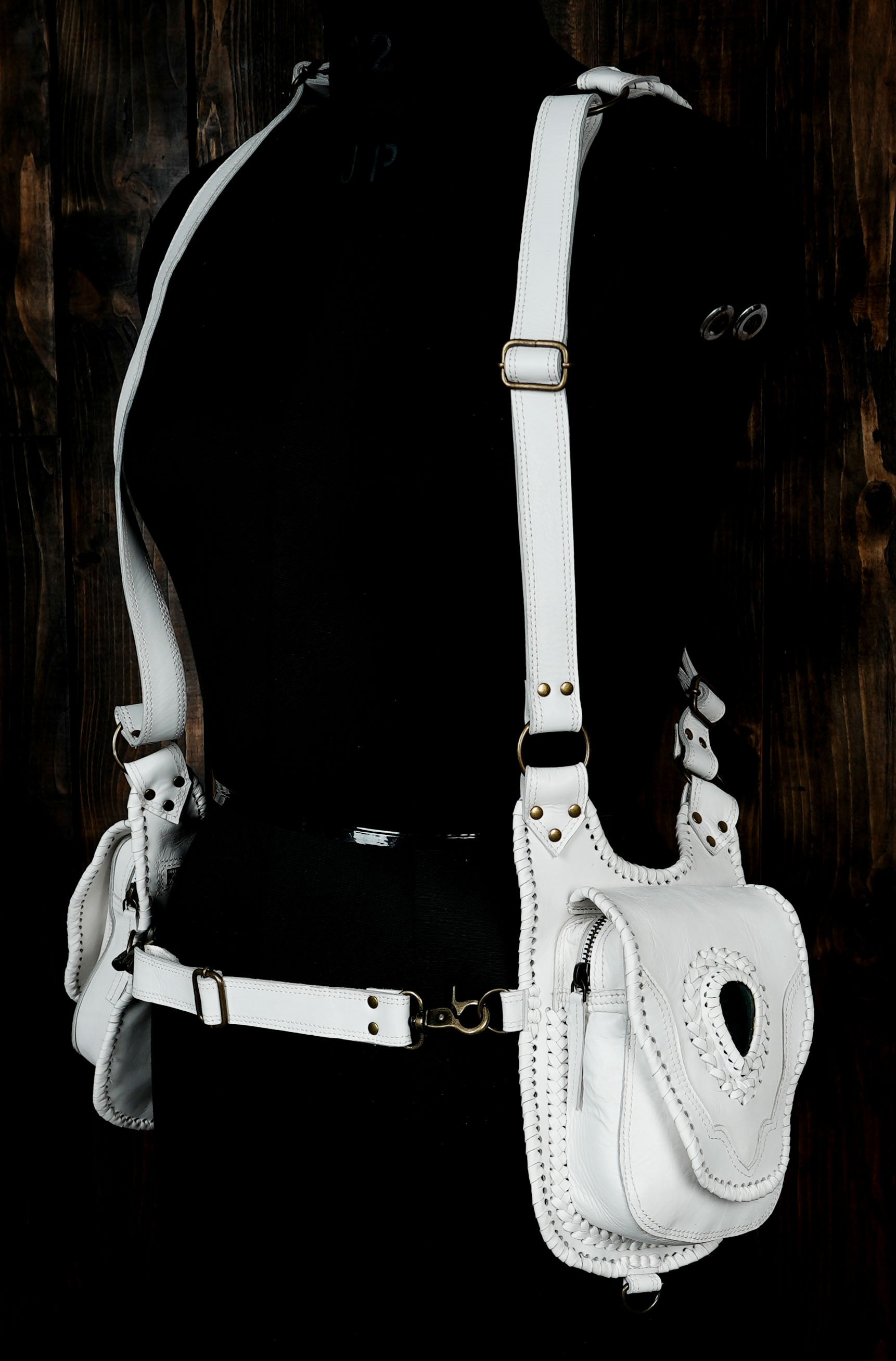 Handwoven white leather utility harness with turquoise gemstone highlights