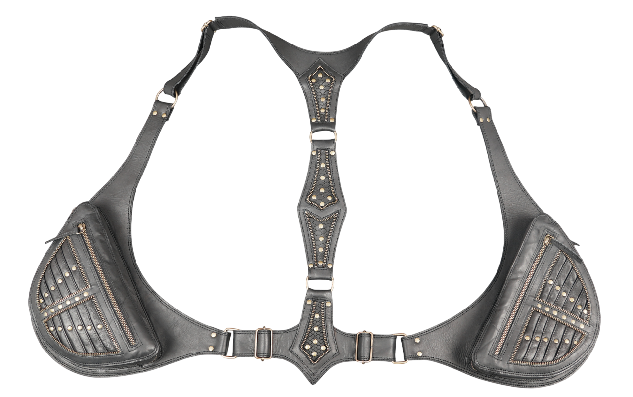 Handcrafted leather harness bag with brass studs and strong straps