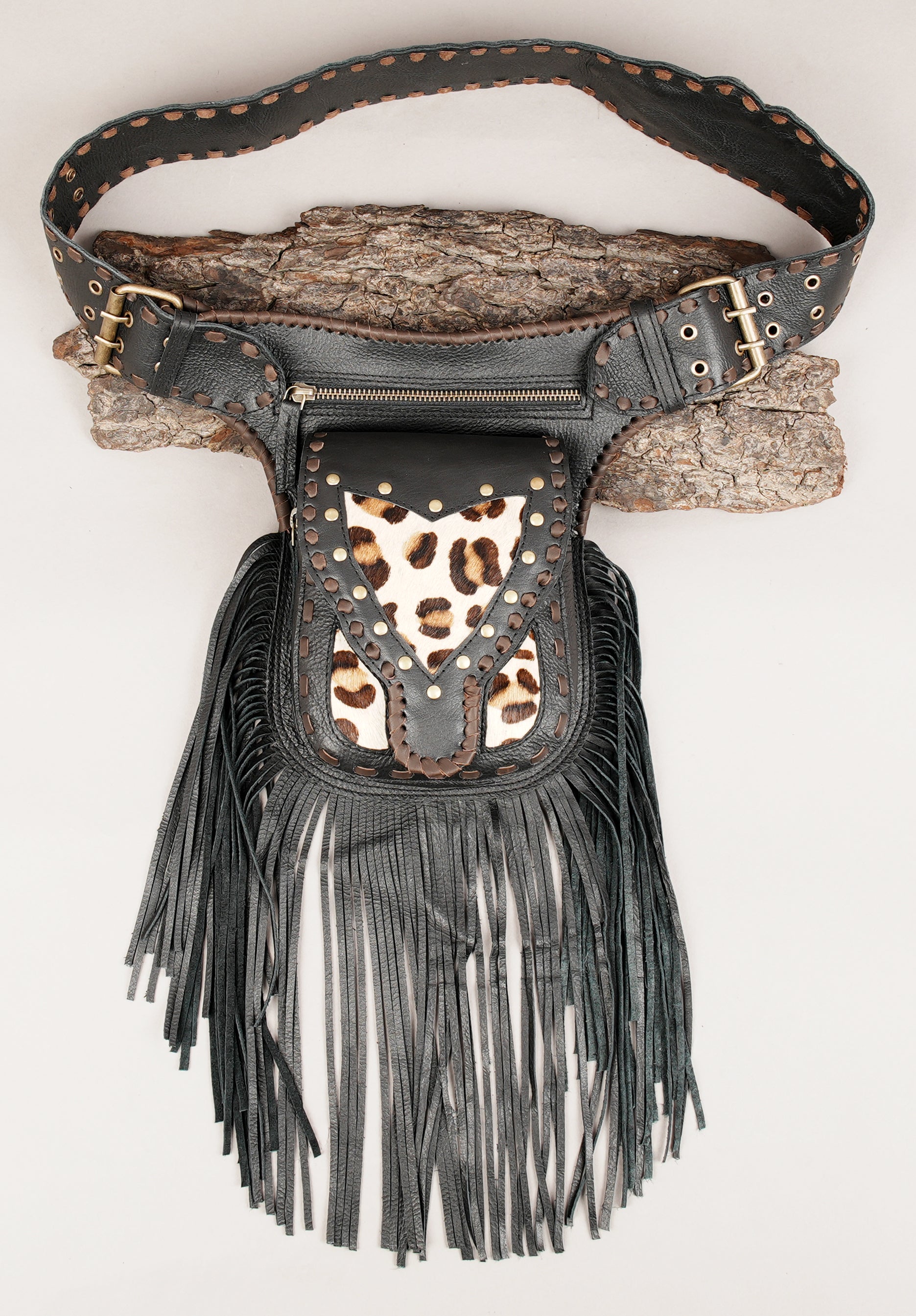 brown boho leather waist bag with fringe and eyelet edge