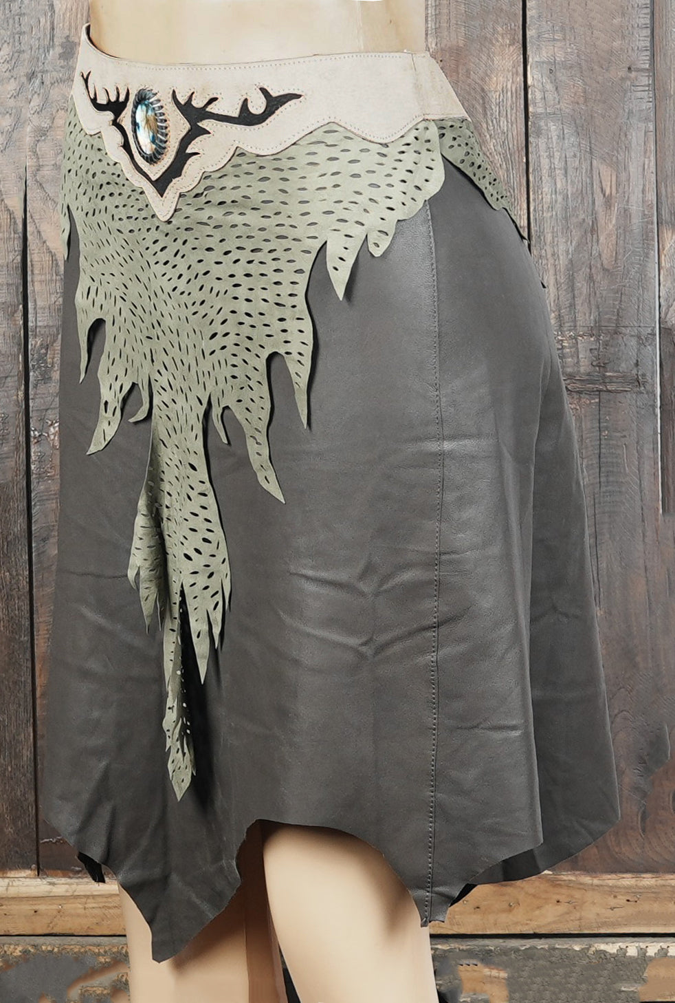 Custom leather skirt with intricate front artwork