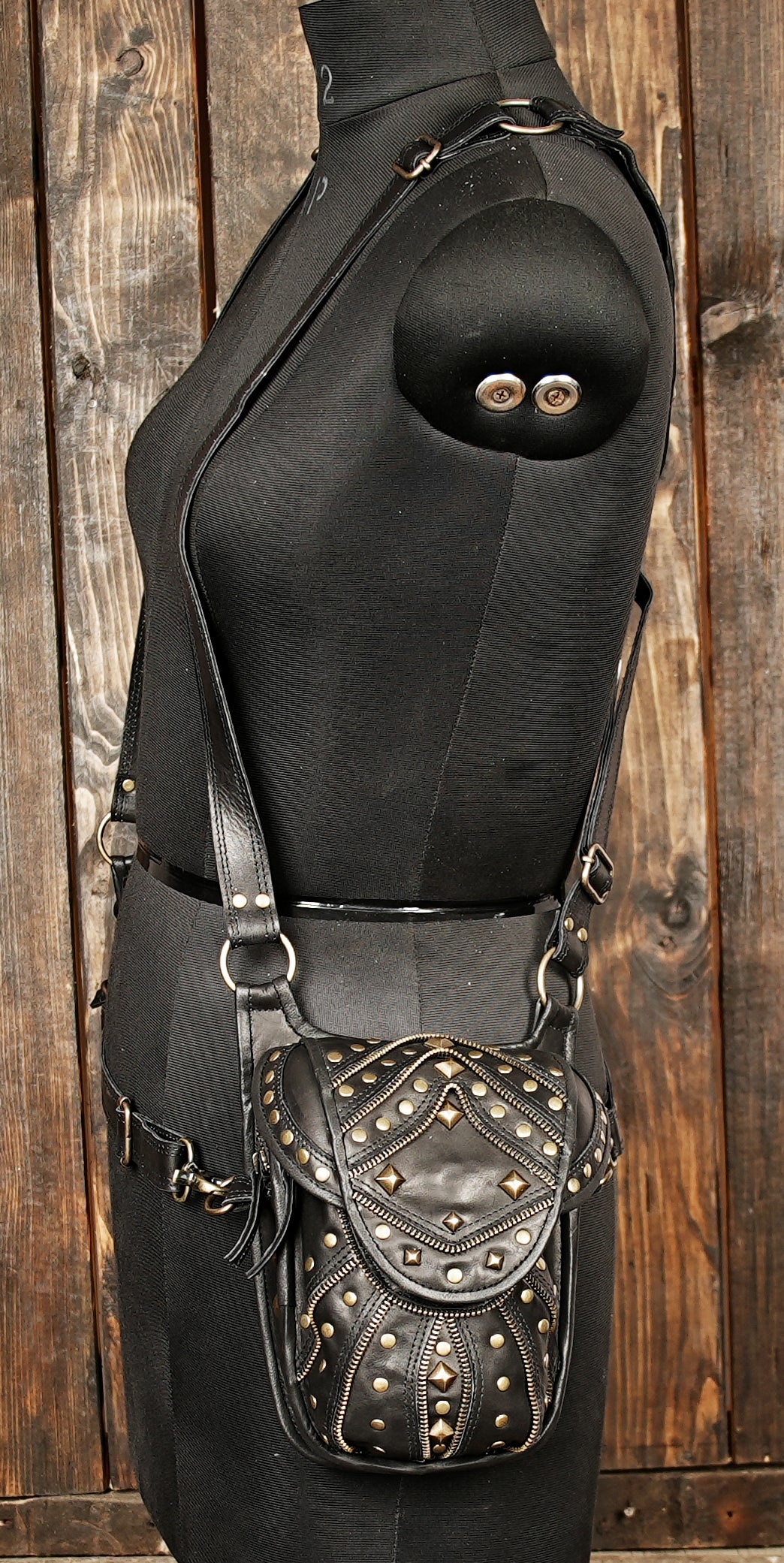Durable black leather holster bag with vintage metal hardware