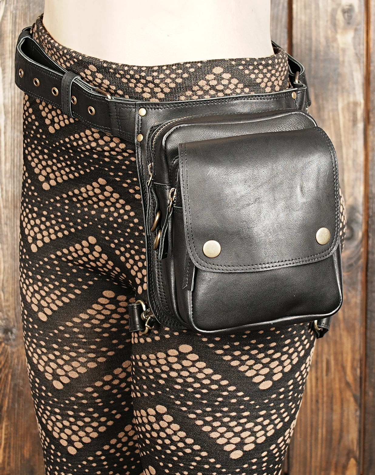 Spacious pouch with flap closure for essentials like phone, wallet, and keys