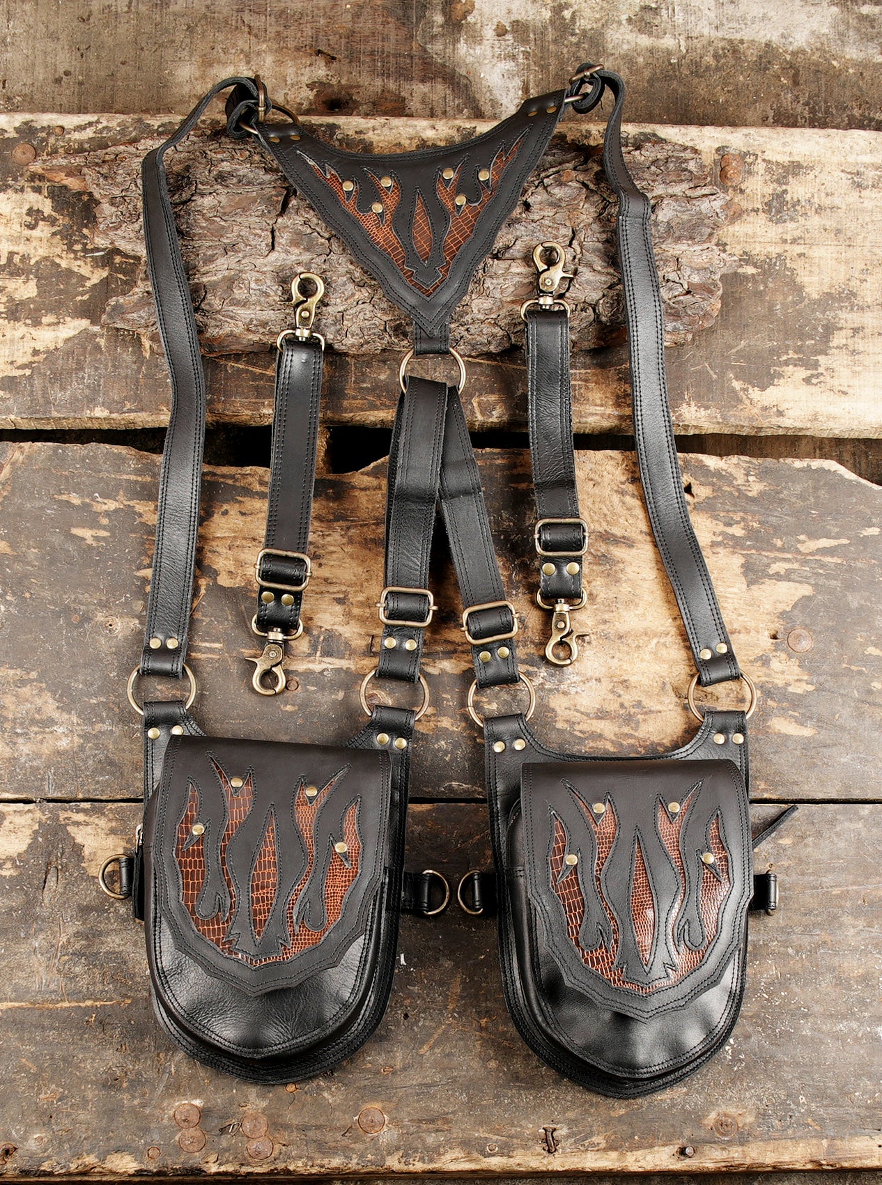 Handmade leather dual holster harness with flame design and brass hardware