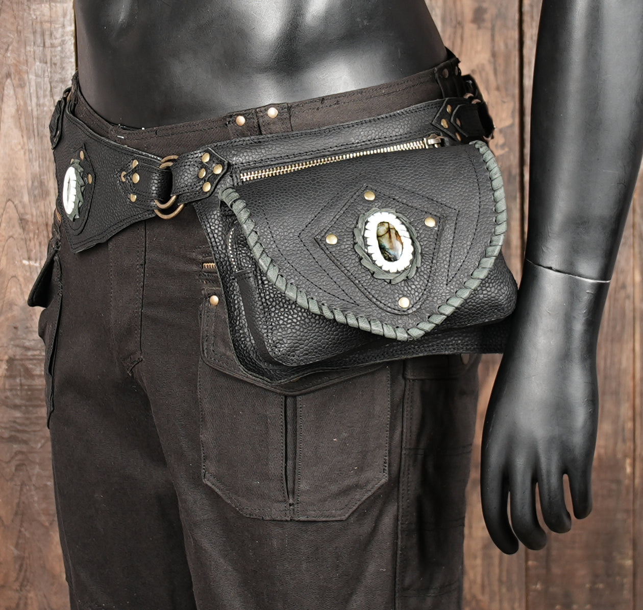 Black leather waist holster with gemstone and multi-ring accents