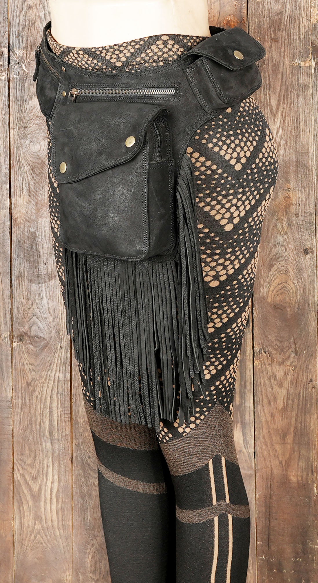 Black cotton fanny pack with fringe and utility pockets