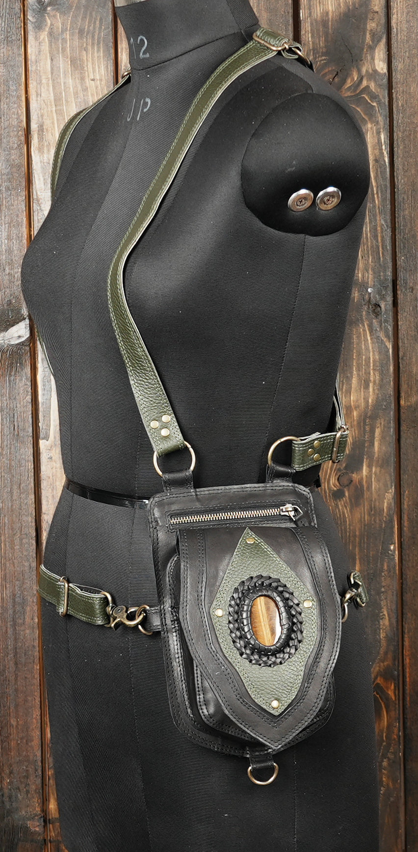 Steampunk-style holster bag with handcrafted design and gemstone embellishments.