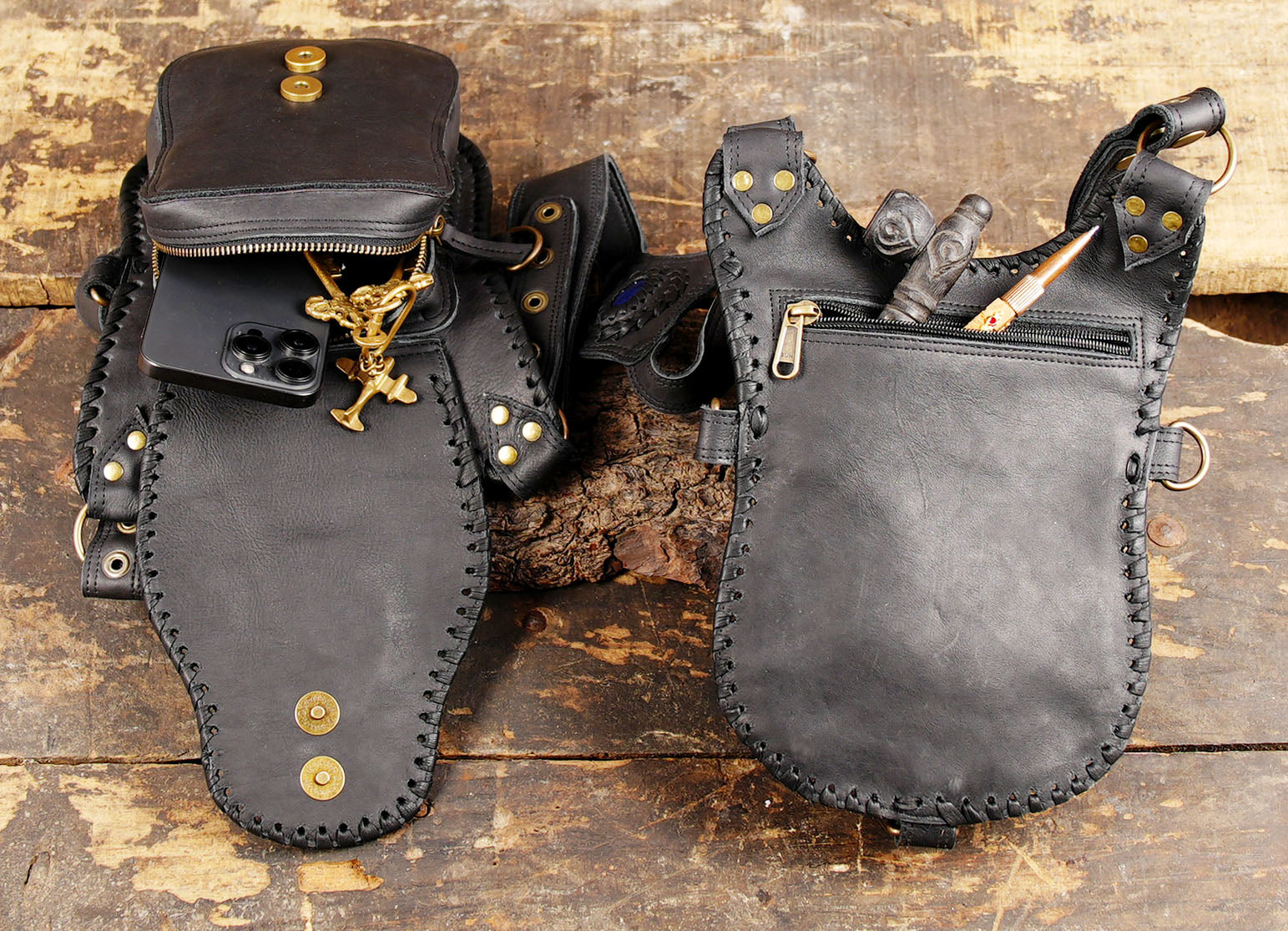 dual-pocket leather holster harness on wood background