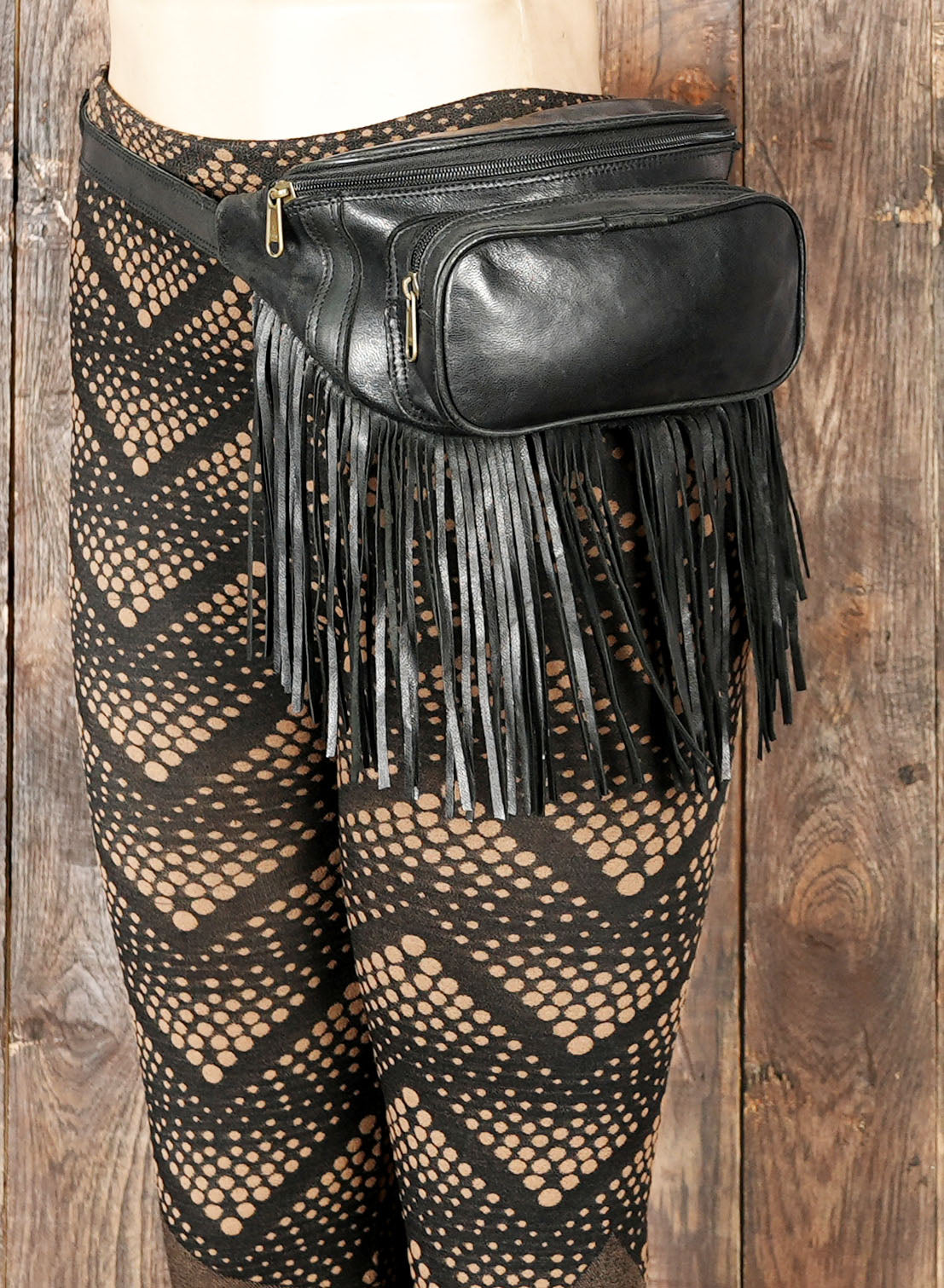 Handcrafted bohemian leather waist bag with fringe design