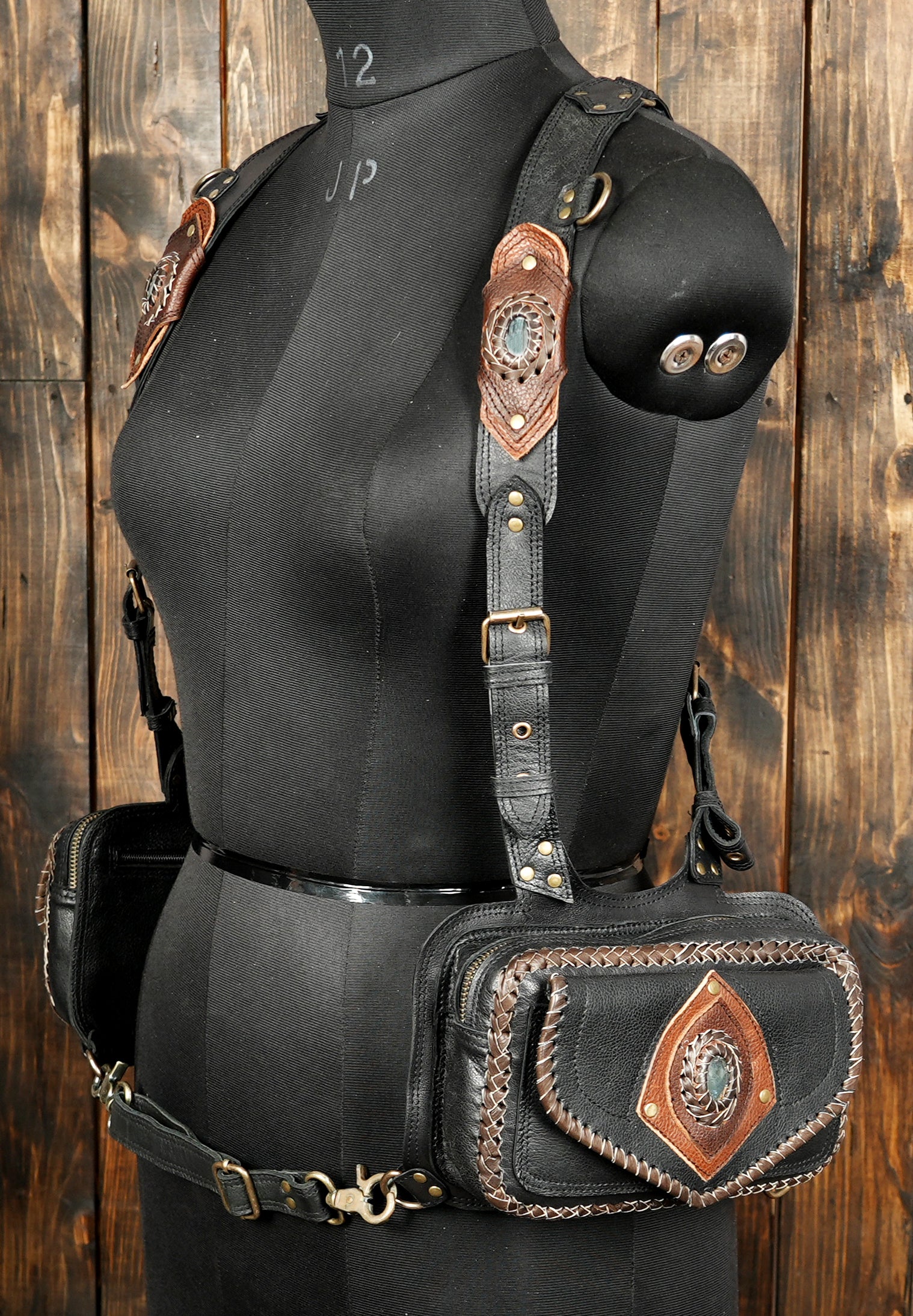 Black leather crossbody harness bag with gemstone inlay