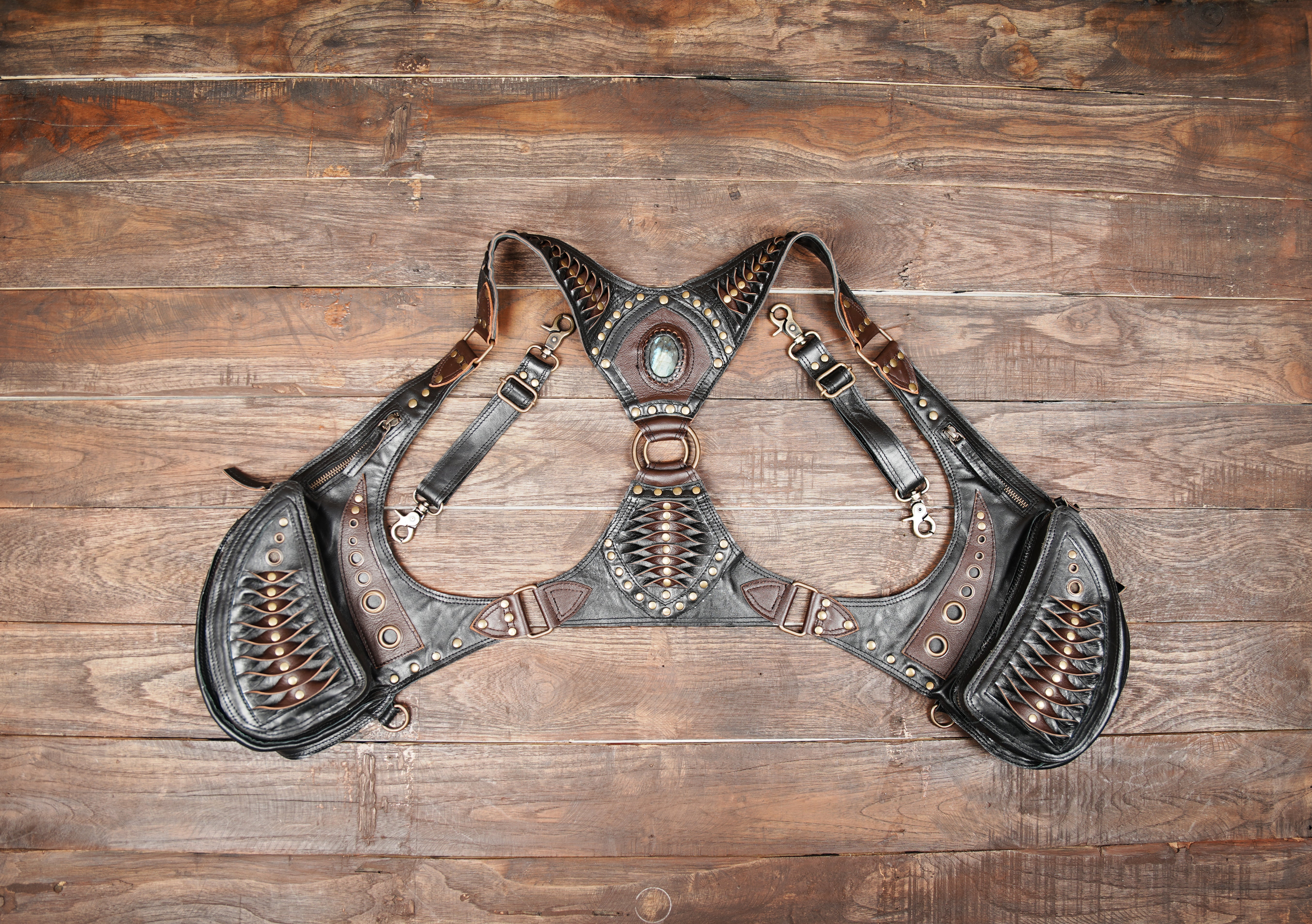 This black & brown handmade leather shoulder holster harness with gemstone centerpiece,