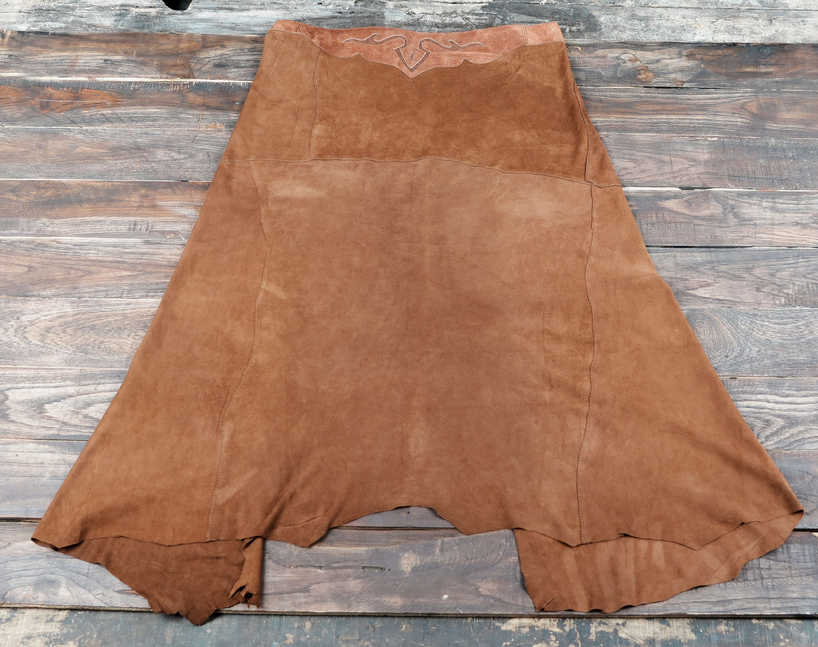 Western leather skirt with subtle embroidery and rustic cut