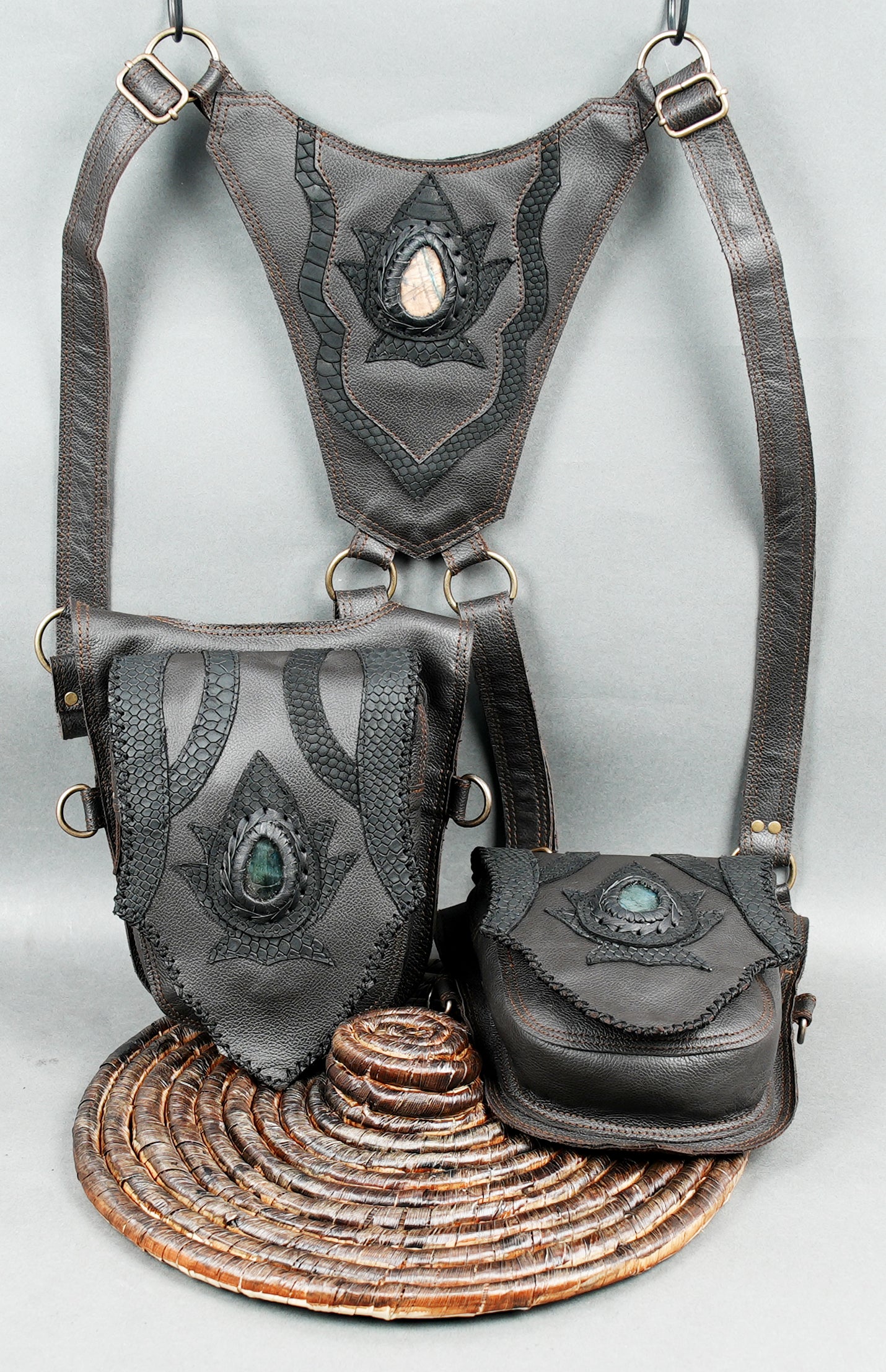 Adjustable handmade leather harness bag with two pouches and unique design.