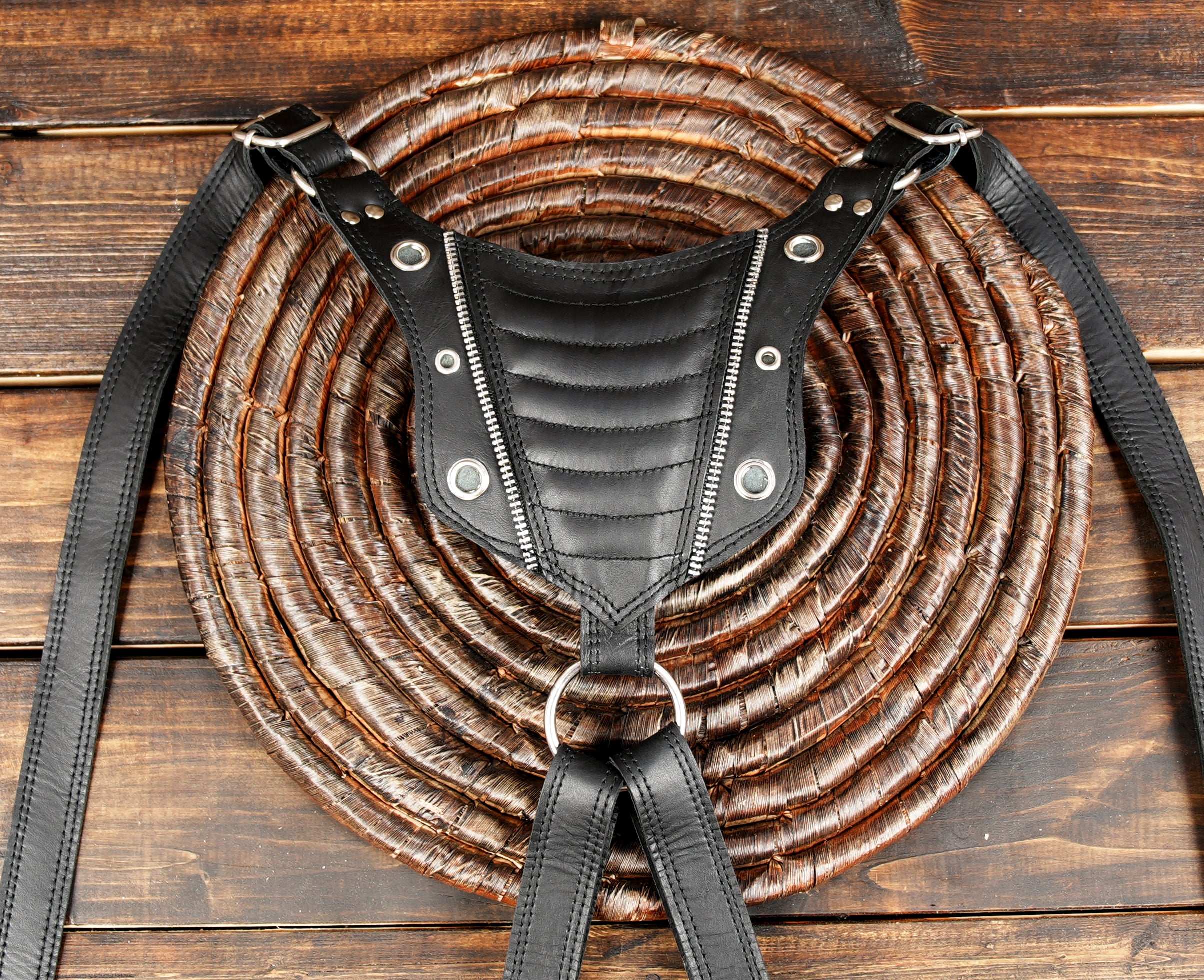 Steampunk-inspired black leather harness with silver hardware