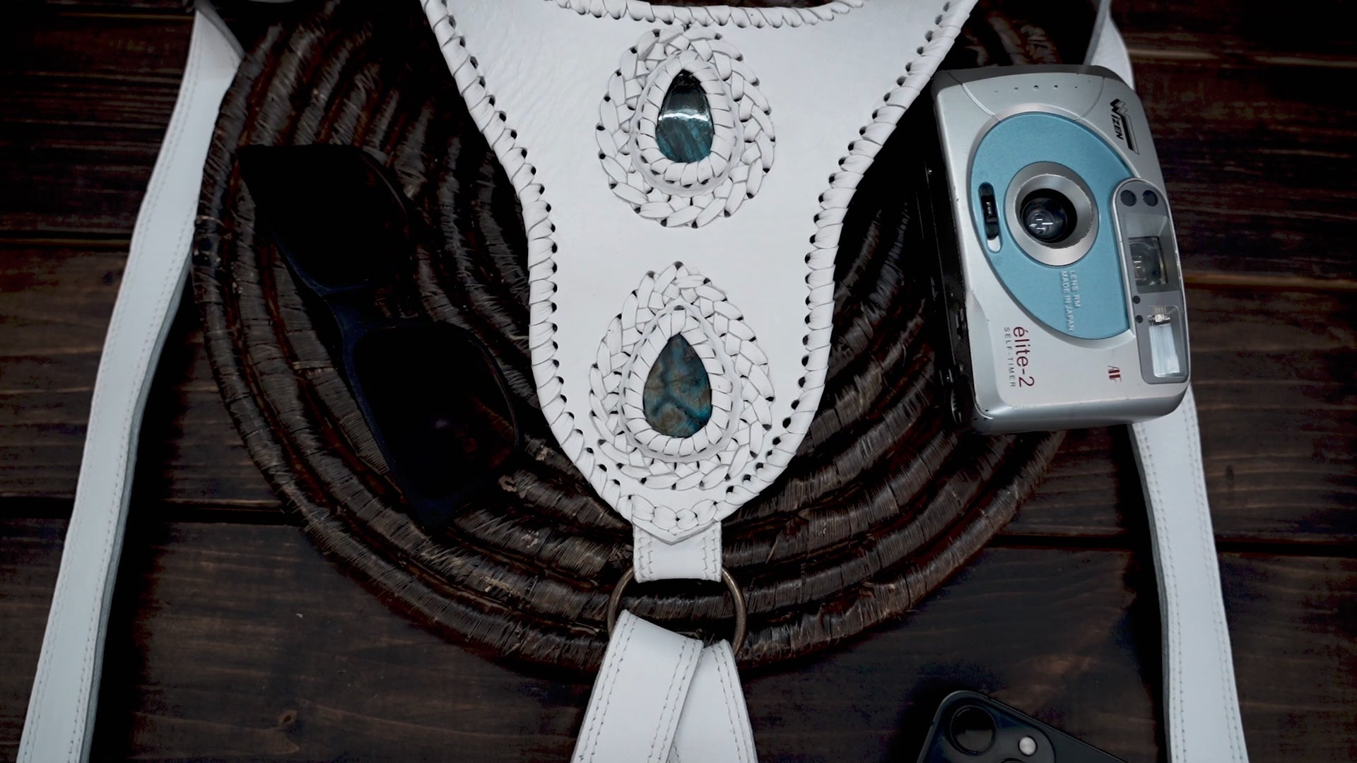 Handmade white waist holster bag featuring detailed stitching and gemstone inlays.