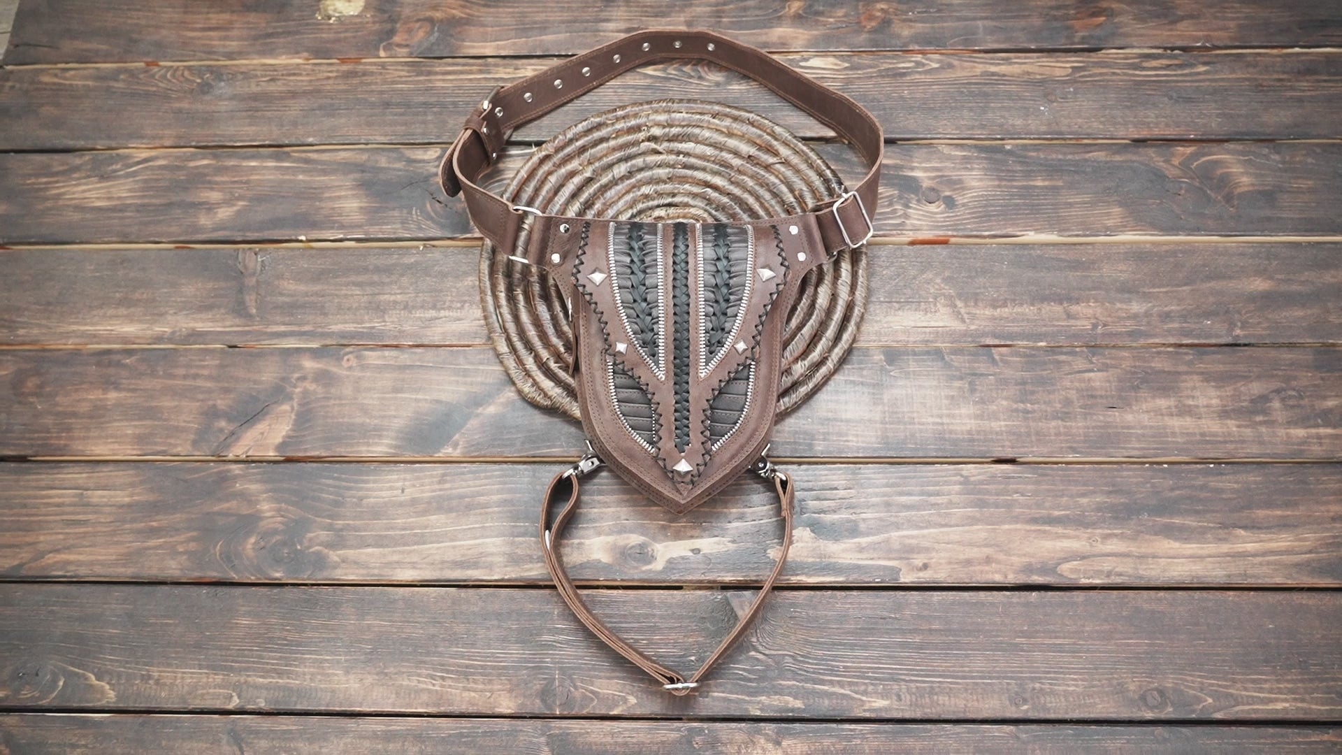 Genuine leather hip and leg belt with tribal pattern design.