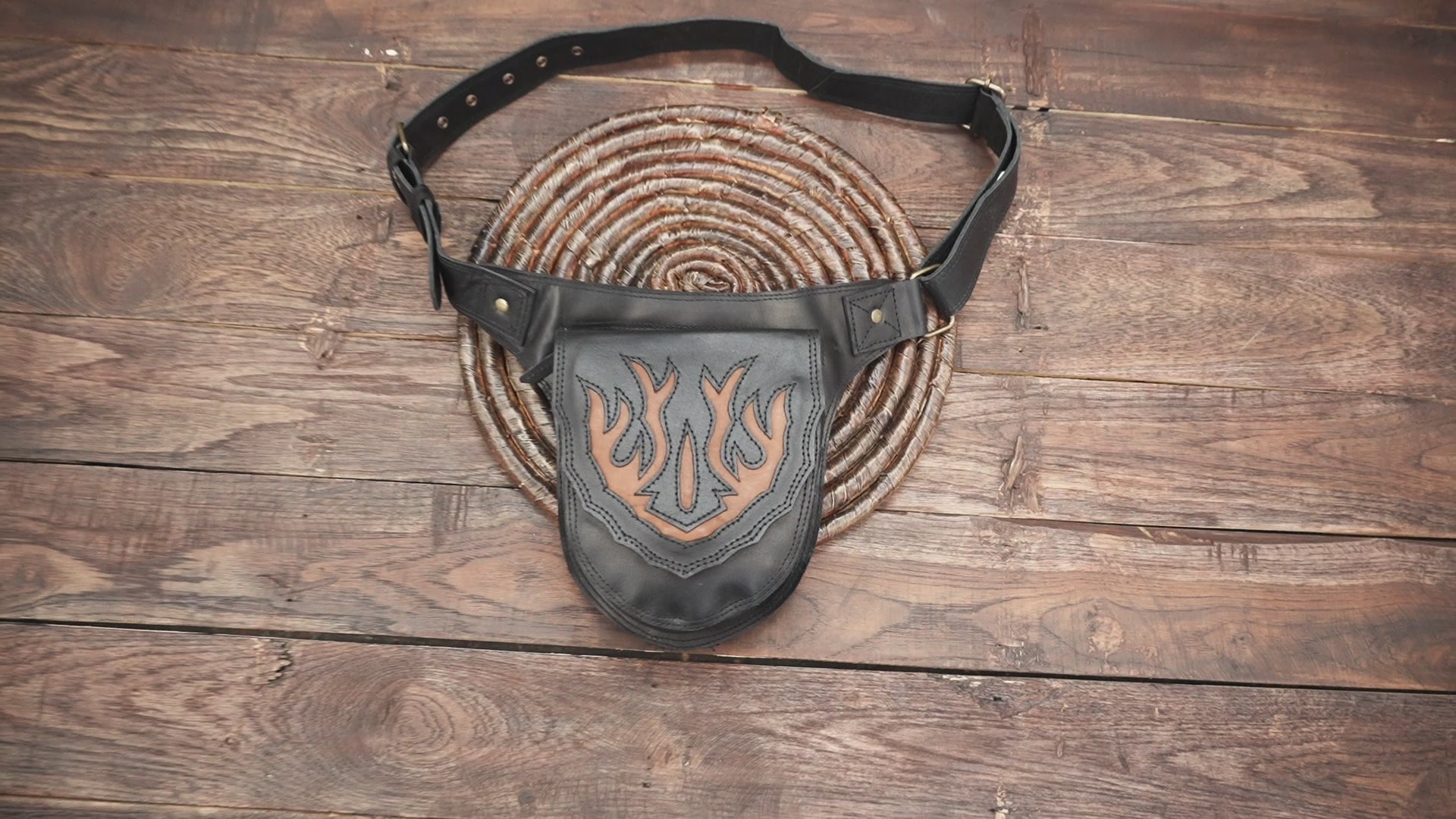Western-style waist pouch crafted from black and tan leather