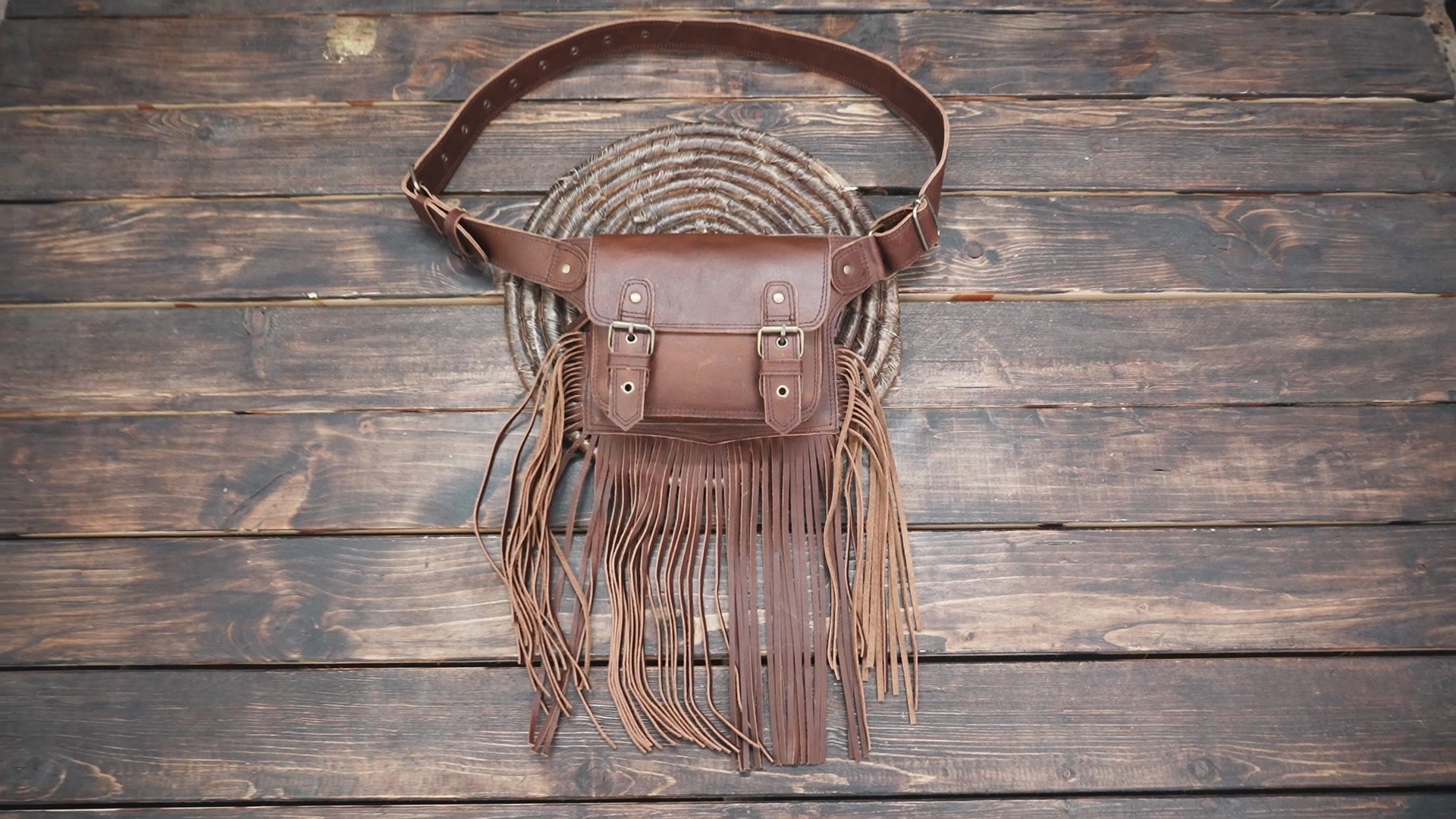 Handmade festival style leather hip pouch with fringe detail
