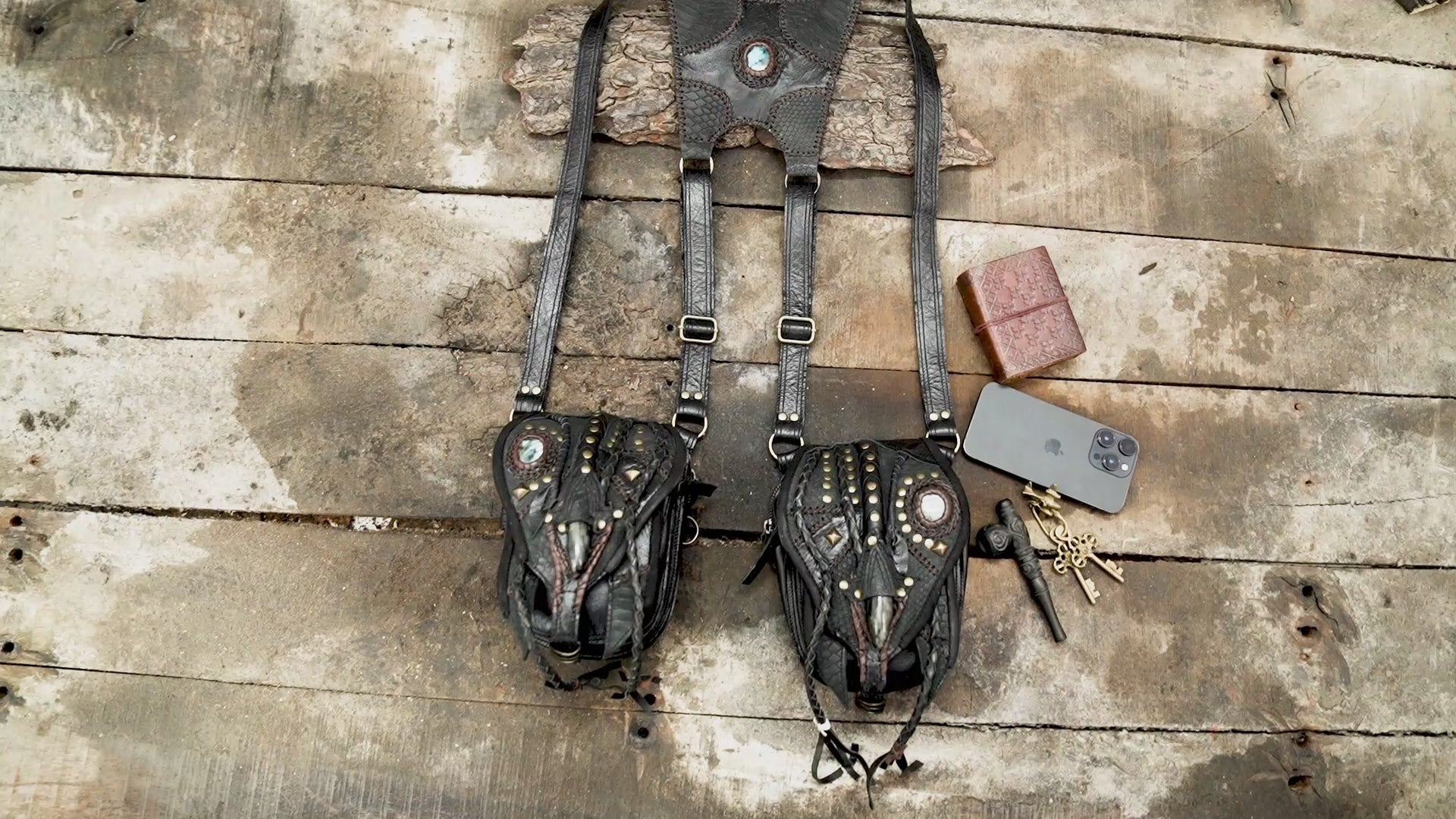 “Artisan dual pouch leather holster with braided details and claw centerpiece”