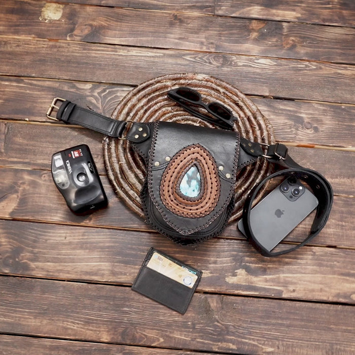 Close-up of artisan leather waist bag with turquoise gemstone