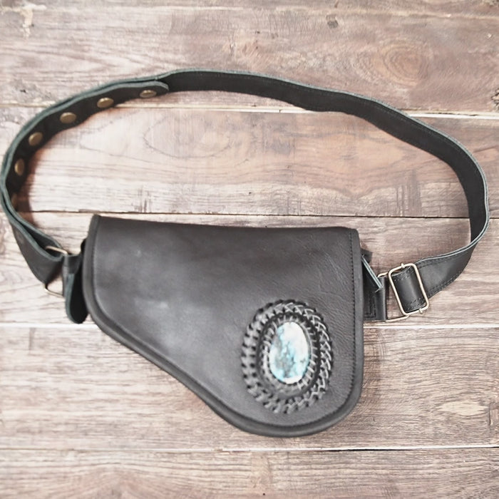 Unisex leather waist pouch with gemstone worn at festival