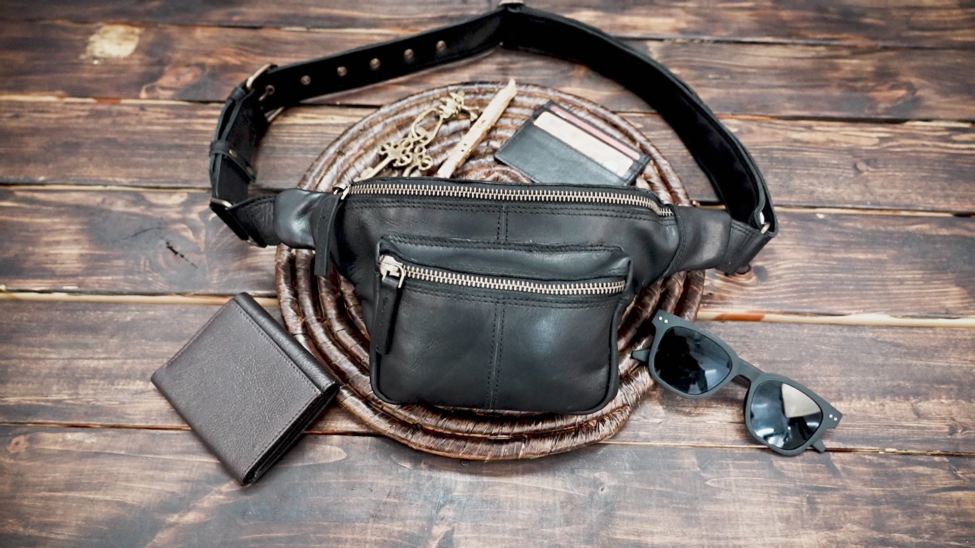 Handmade black leather fanny pack with zipper pockets