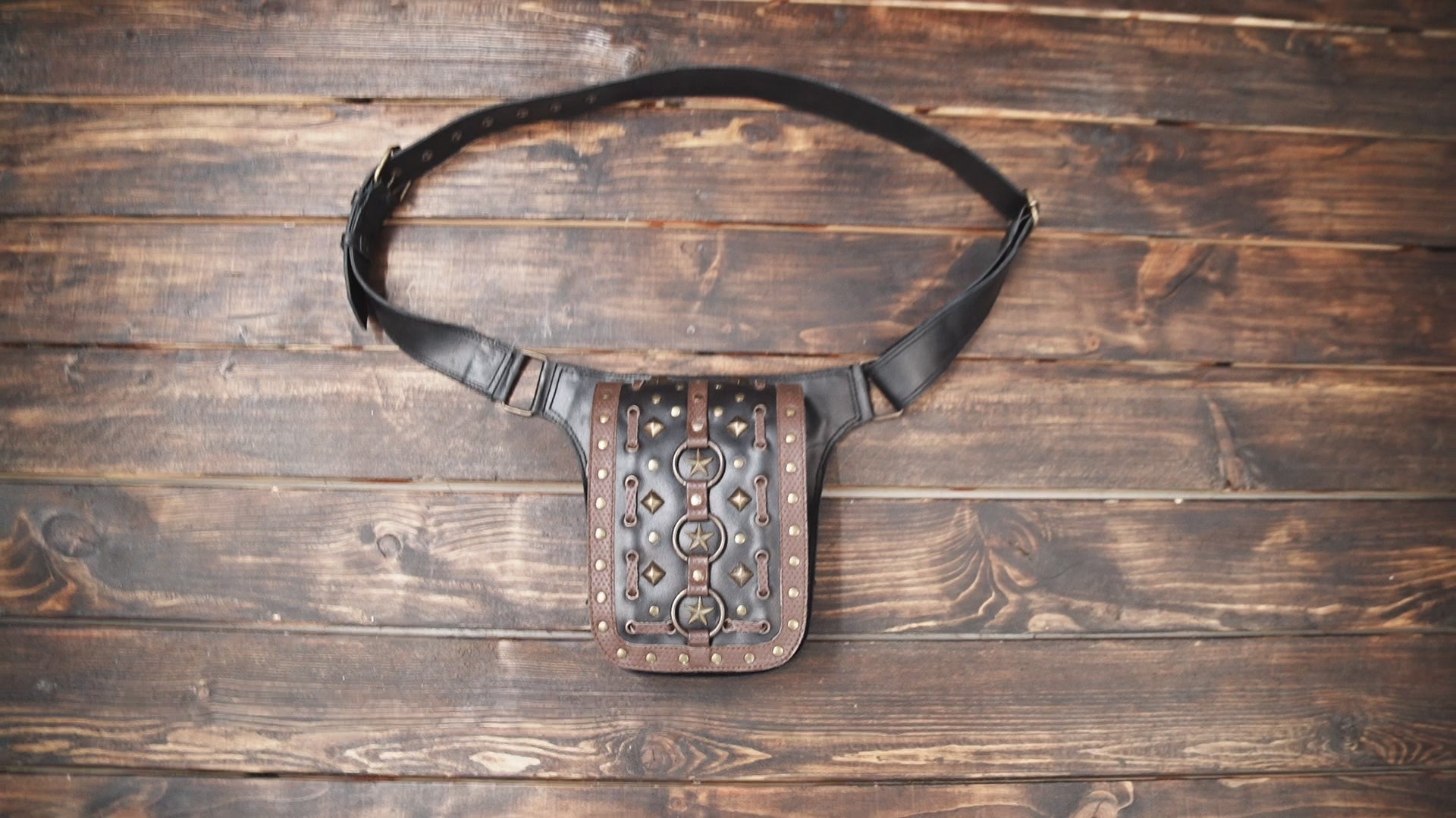 Gothic leather waist bag with star rings and rivets