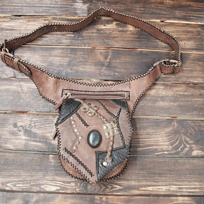 Steampunk-style leather waist bag with gemstone centerpiece and vintage design