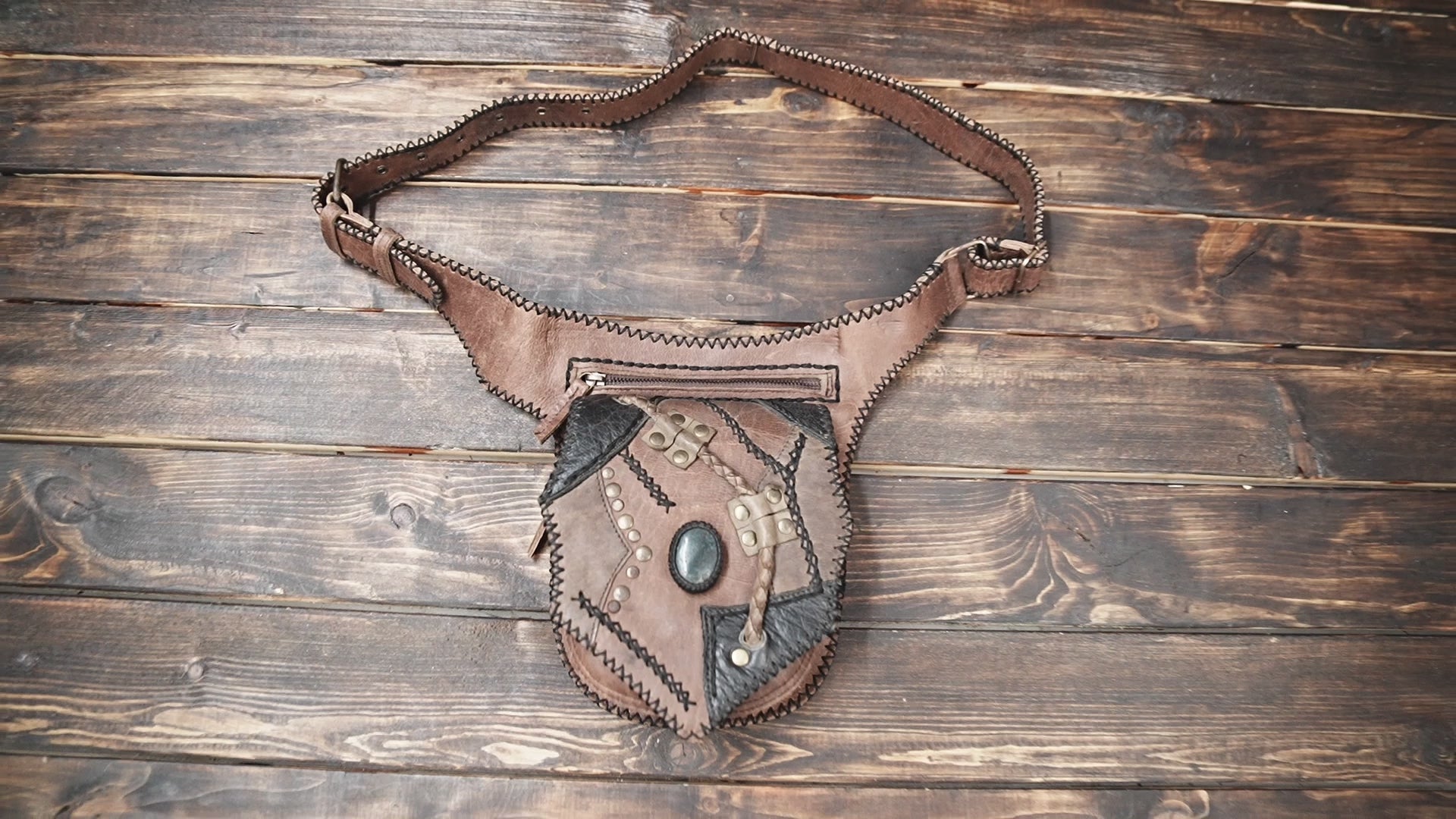Steampunk-style leather waist bag with gemstone centerpiece and vintage design
