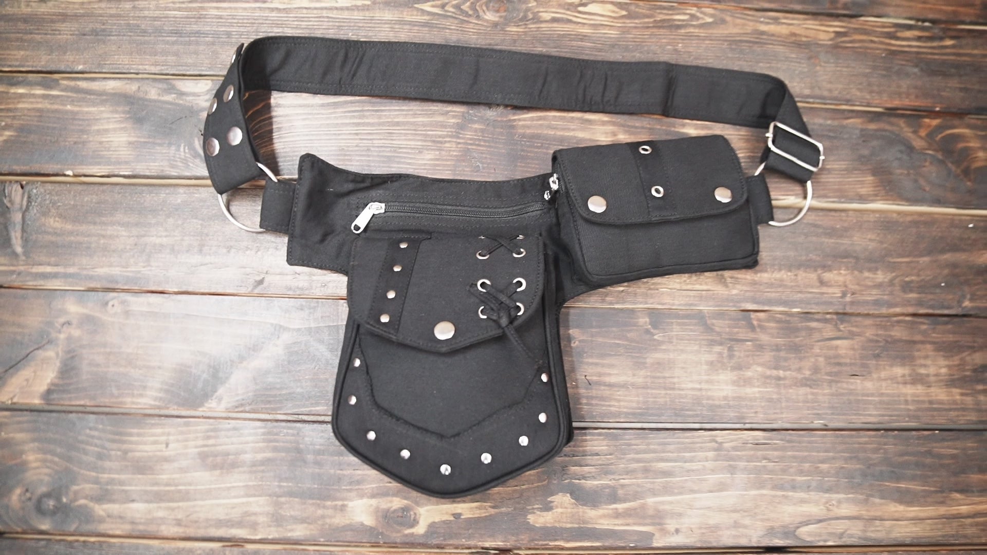 Close-up of lace-up design on cotton waist bag front pocket