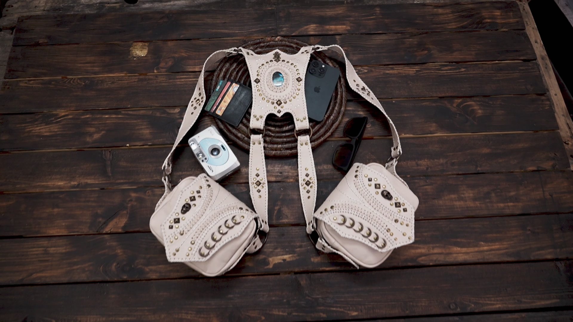 Close-up of handcrafted leather holster bag with brass studs