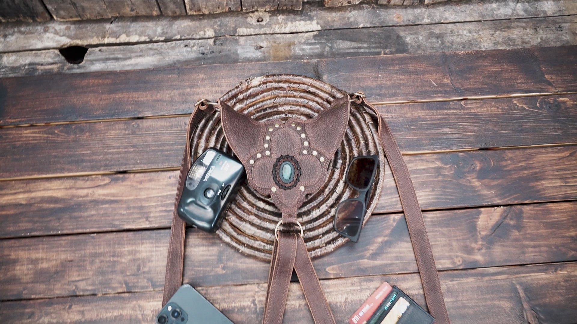 Artisan leather festival bag with dual pockets and brass rivets