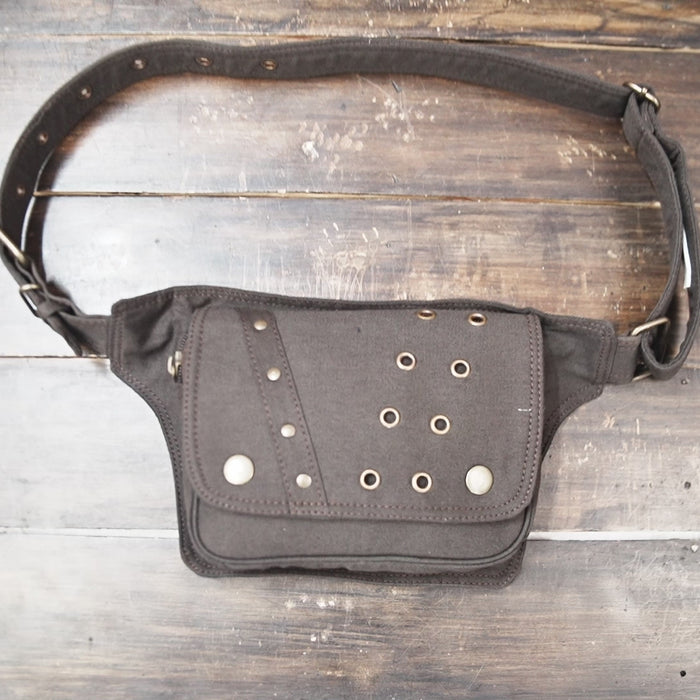 Steampunk style brown hip bag with metal eyelets and flap