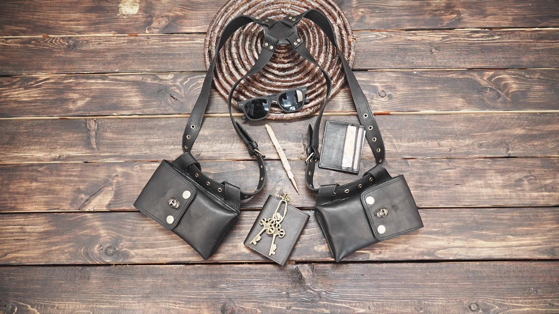 Back view of black leather holster bag with adjustable straps