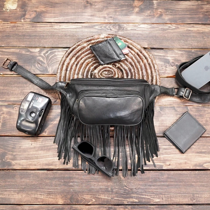 Festival style black leather fanny pack with fringe details
