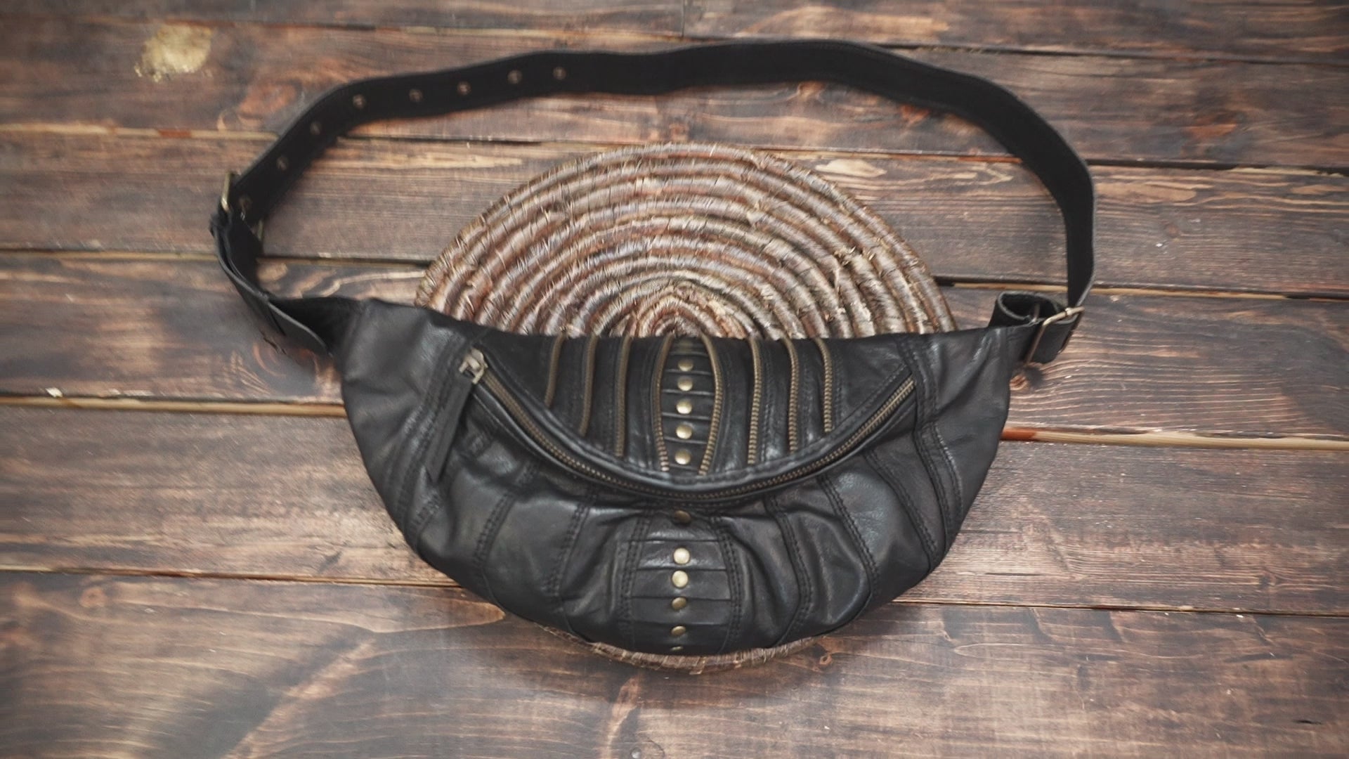 Steampunk-inspired leather fanny pack with multi-zip pockets and bold style.