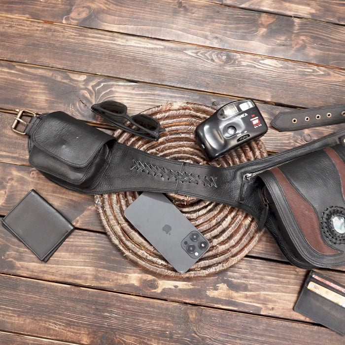 Close-up of gemstone detail on black leather hip bag