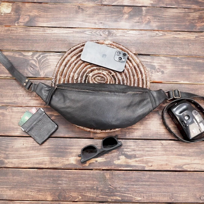Minimalist leather fanny pack in black with zipper closure