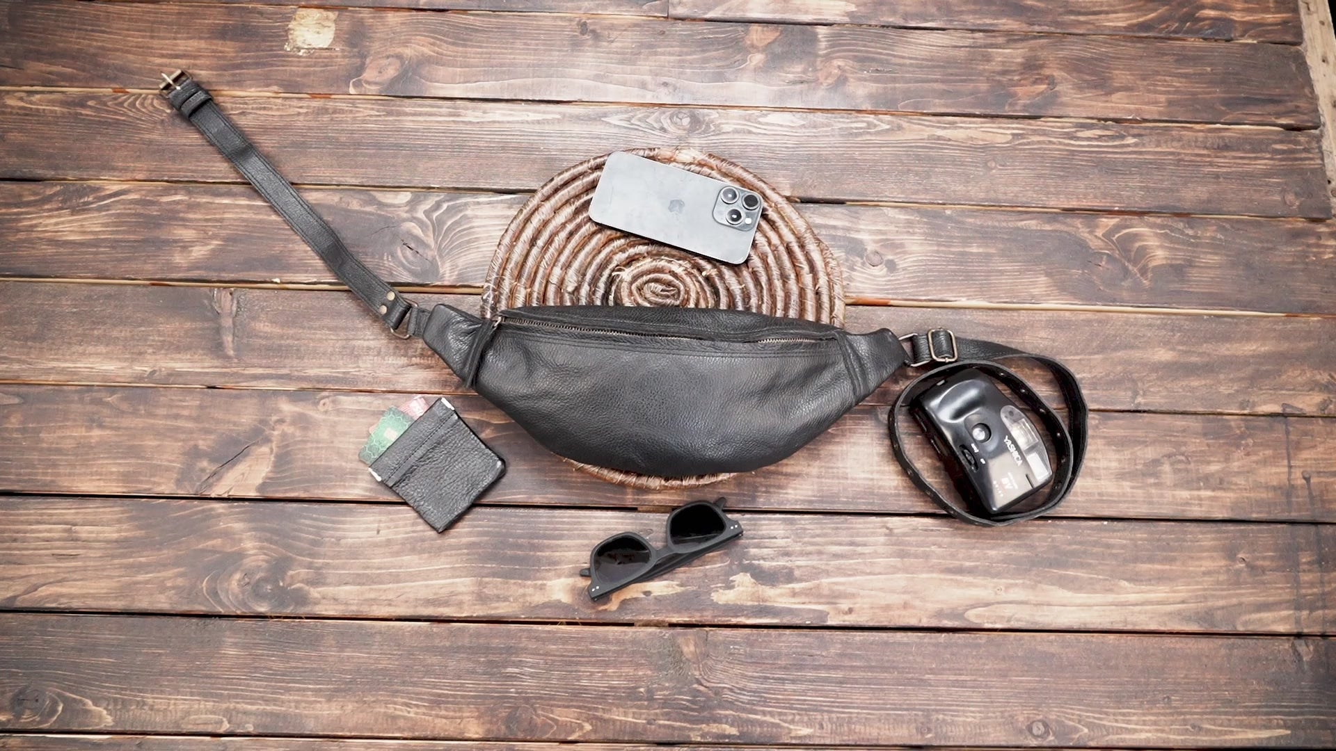 Minimalist leather fanny pack in black with zipper closure