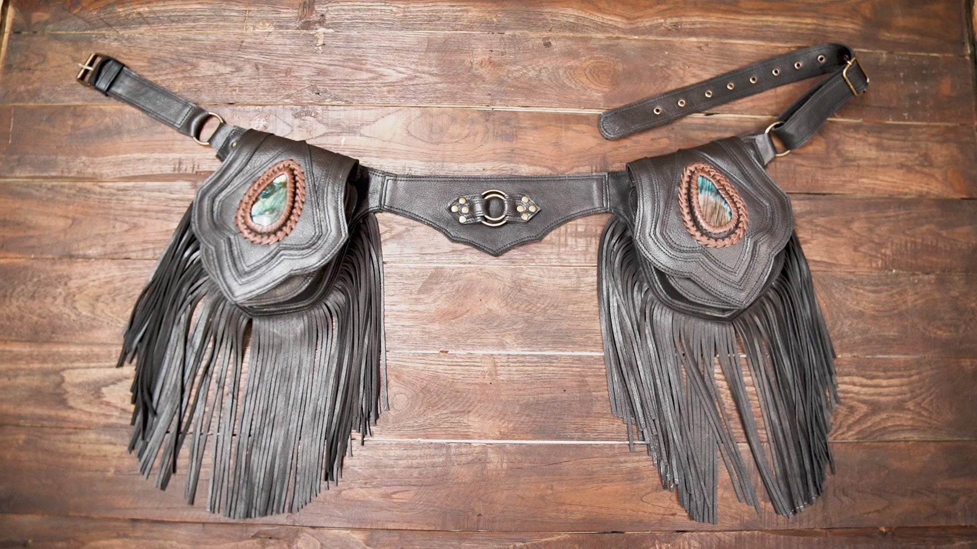 Western-style hip pouch with black leather and long fringe