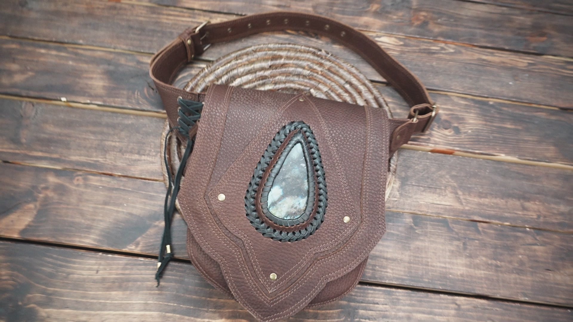 Adventure style waist utility pouch with textured leather and strong rivets