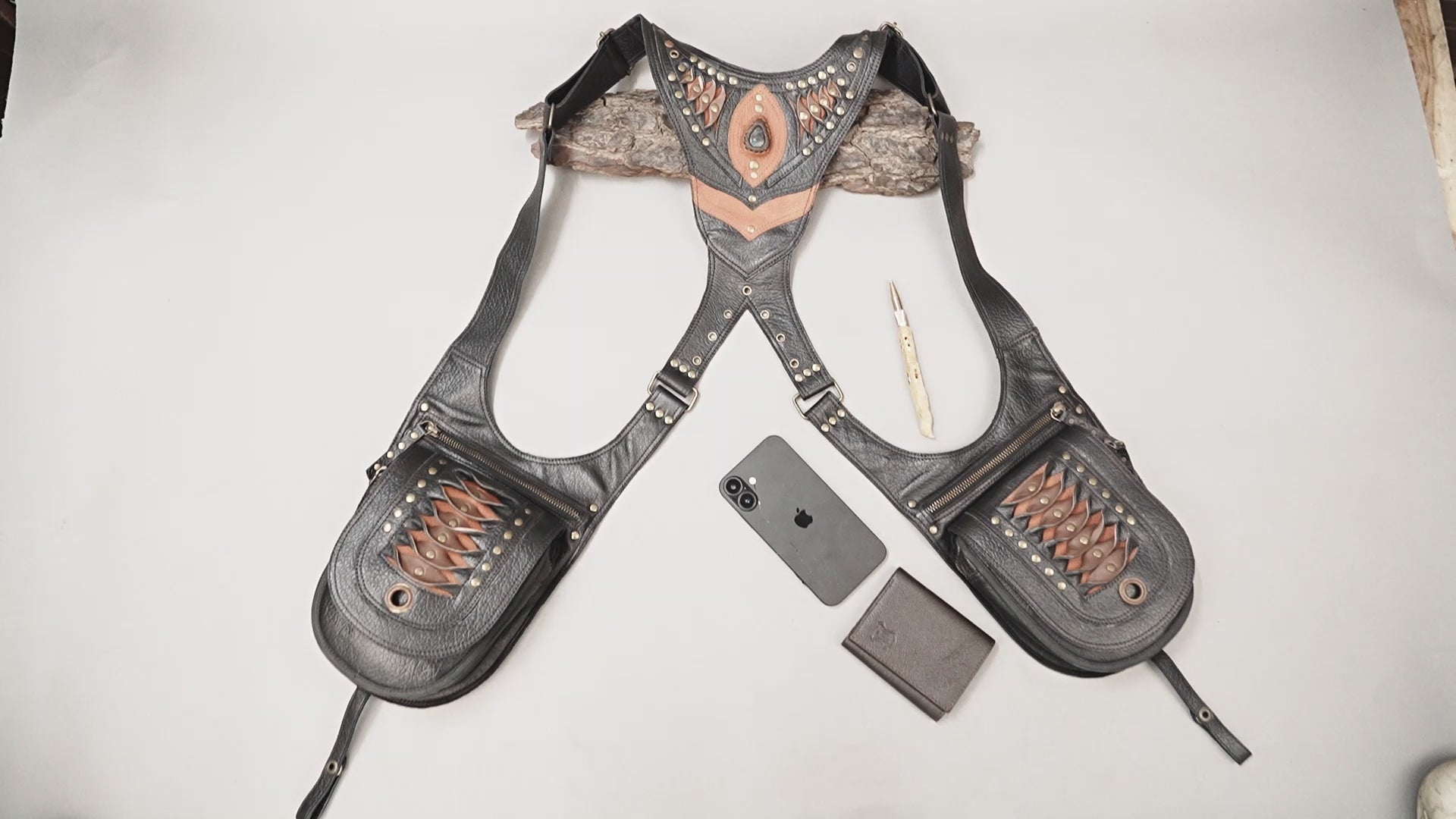 Steampunk leather chest harness with adjustable straps and utility pouches